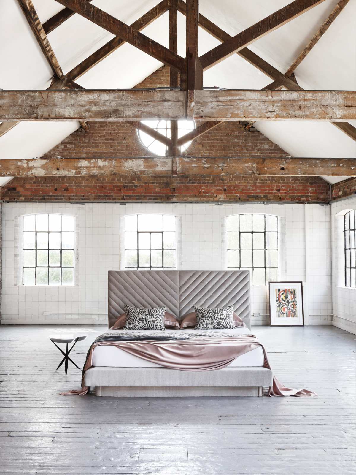 Stella design featuring a soft mohair headboard, adorned in light pink bedding.